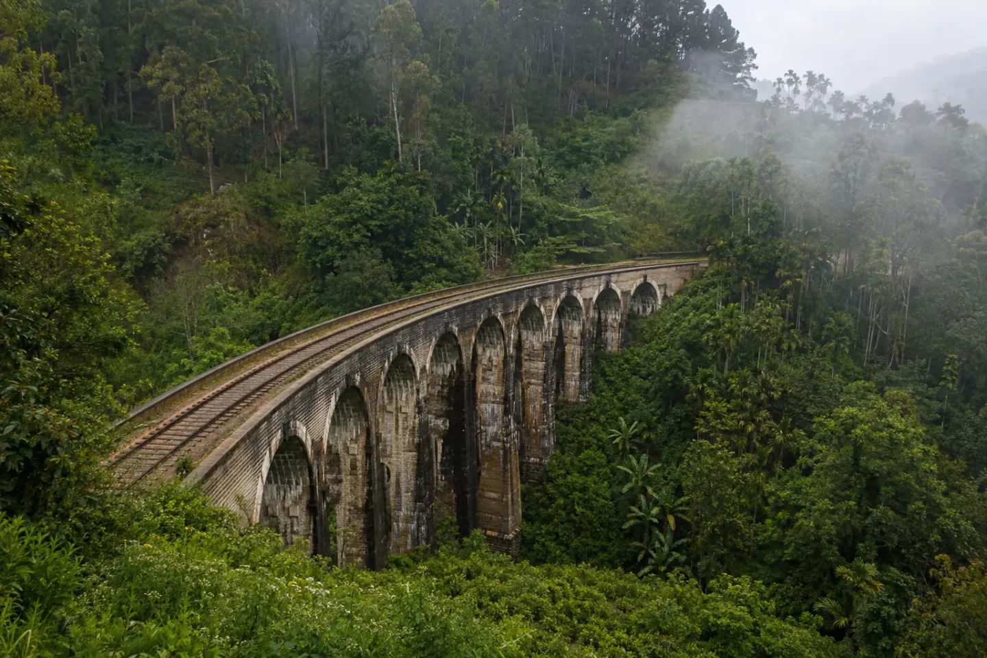 AI-generated illustration of the Nine Arch Bridge among the green hills near Ella